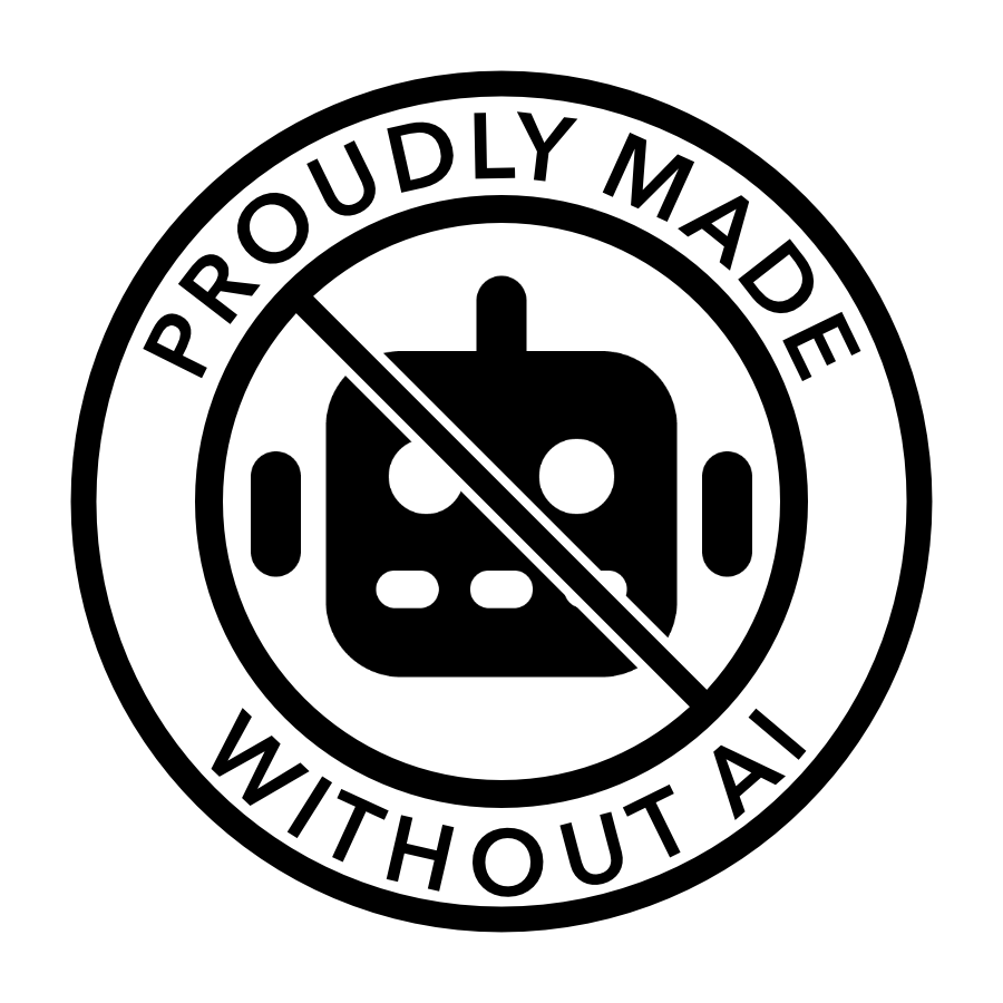 Circle with a slash across an emoji robot face. The words 'proudly made without AI' are around the outside edge of the circle